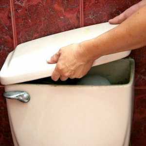 Hoe om die handvatsel van `n toilet te installeer